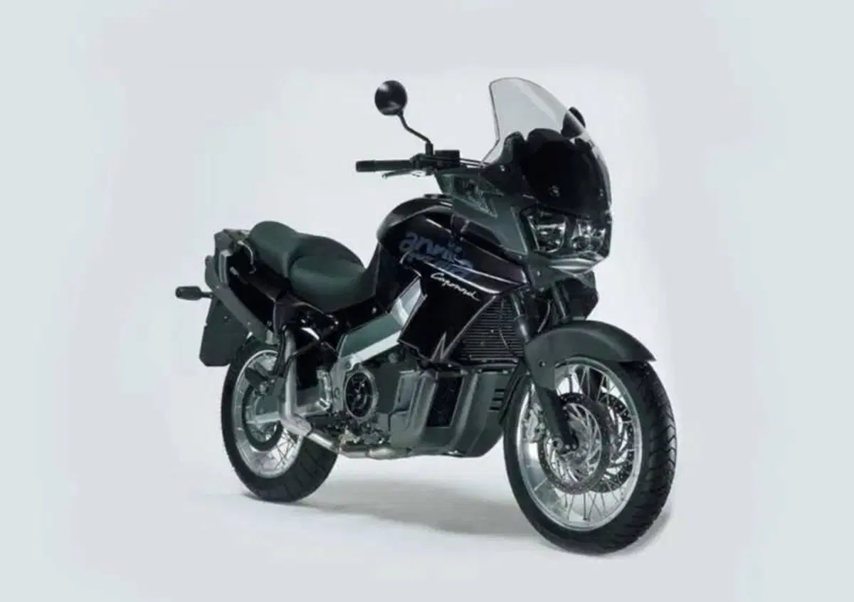 Pedana Post. Sx e Frecce Aprilia ETV 1000 Caponord
